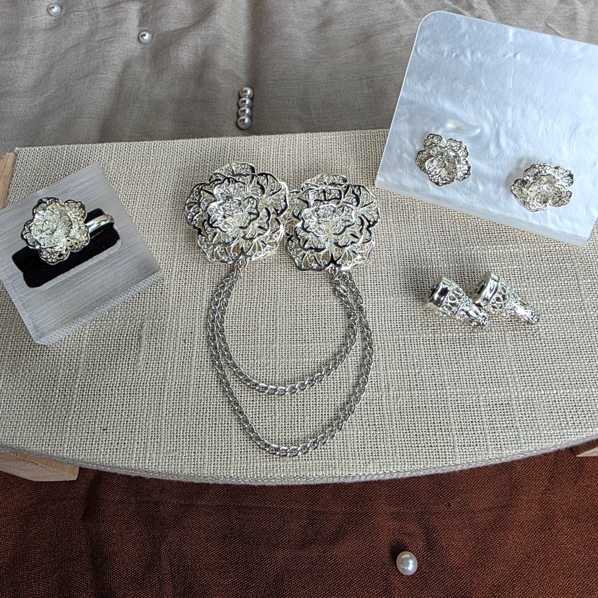 POYA silver alloy Kerongsang set featuring twin rose brooches with chains, matching earrings, and an adjustable ring.