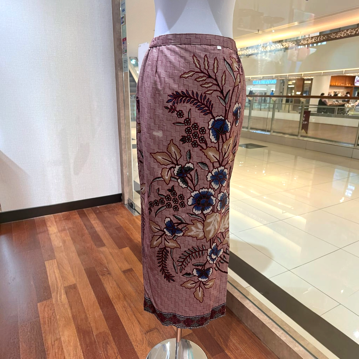 POYA maroon batik skirt featuring a floral pattern, front overlap design, and a comfortable half-elastic waist.
